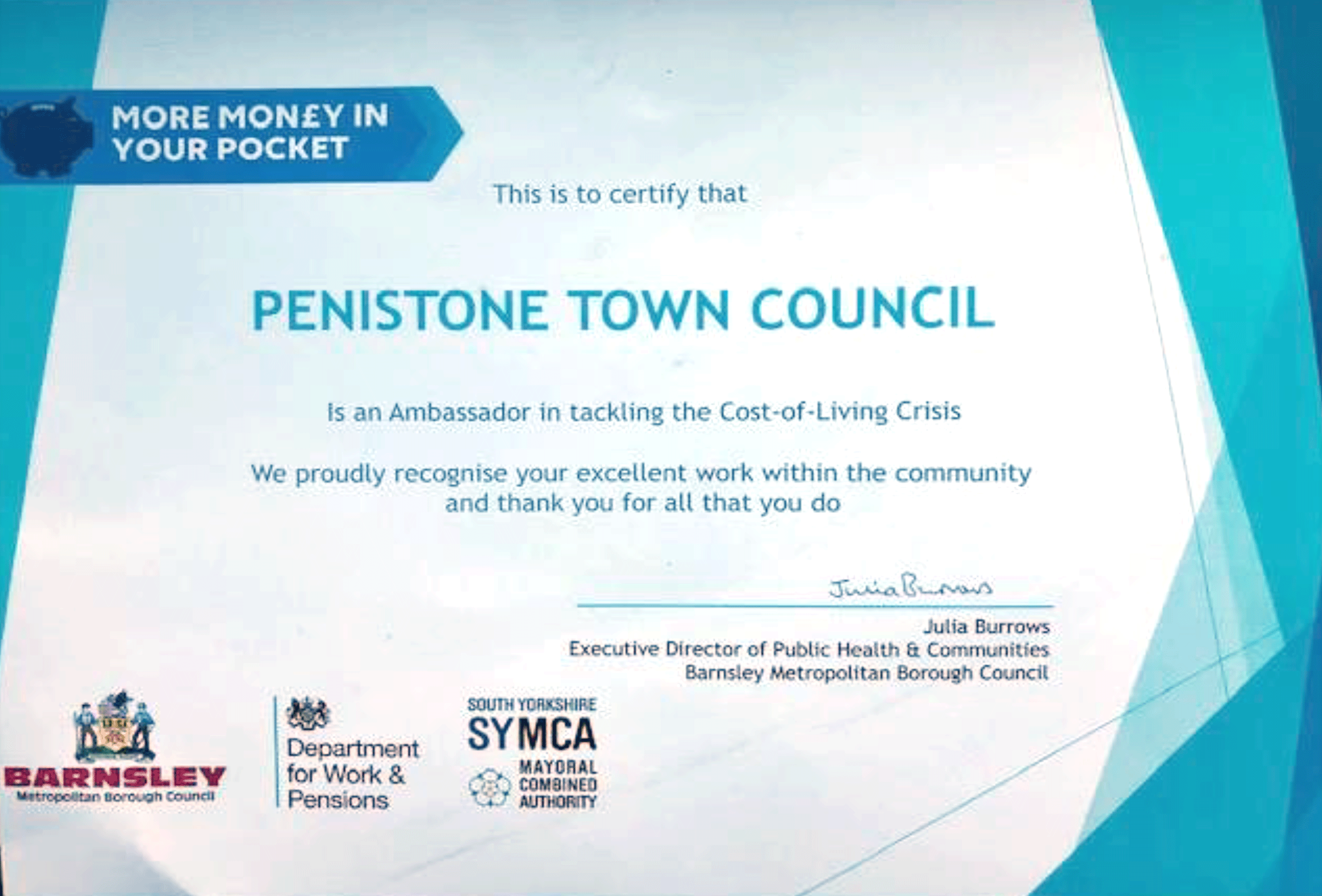 Certificate from BMBC. Mina text reads"This is to certify that Penistone Town Council is an ambassador in tackling the Cost-of-Living Crisis. We proudly recognise your excellent work within the community and thank you for all that you do."