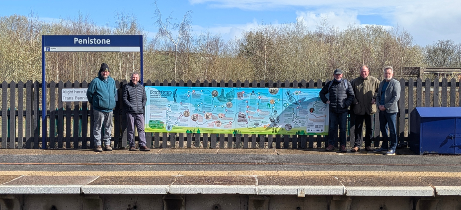 The timeline in situ along with members of the group
