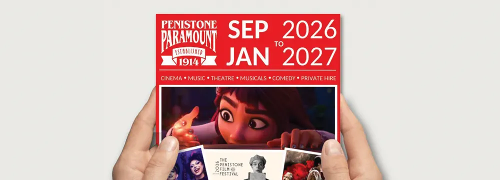 Hands holding the Paramount brochure (mockup)